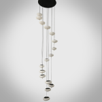 Modern spiral pebble optical acrylic staircase chandelier cascading down a high ceiling foyer