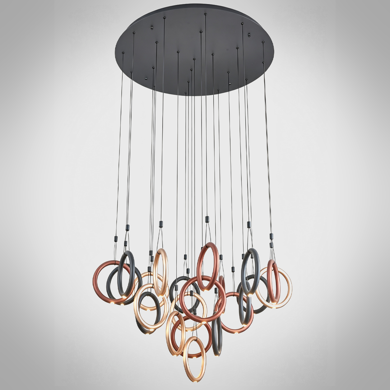 Modern multi-tone ring cascade chandelier with gold, bronze, and black hoops for high ceiling staircase and foyer