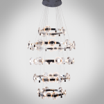 Illuminated multi-tier chrome ring crystal lens disc chandelier for high ceiling foyer and luxury staircase