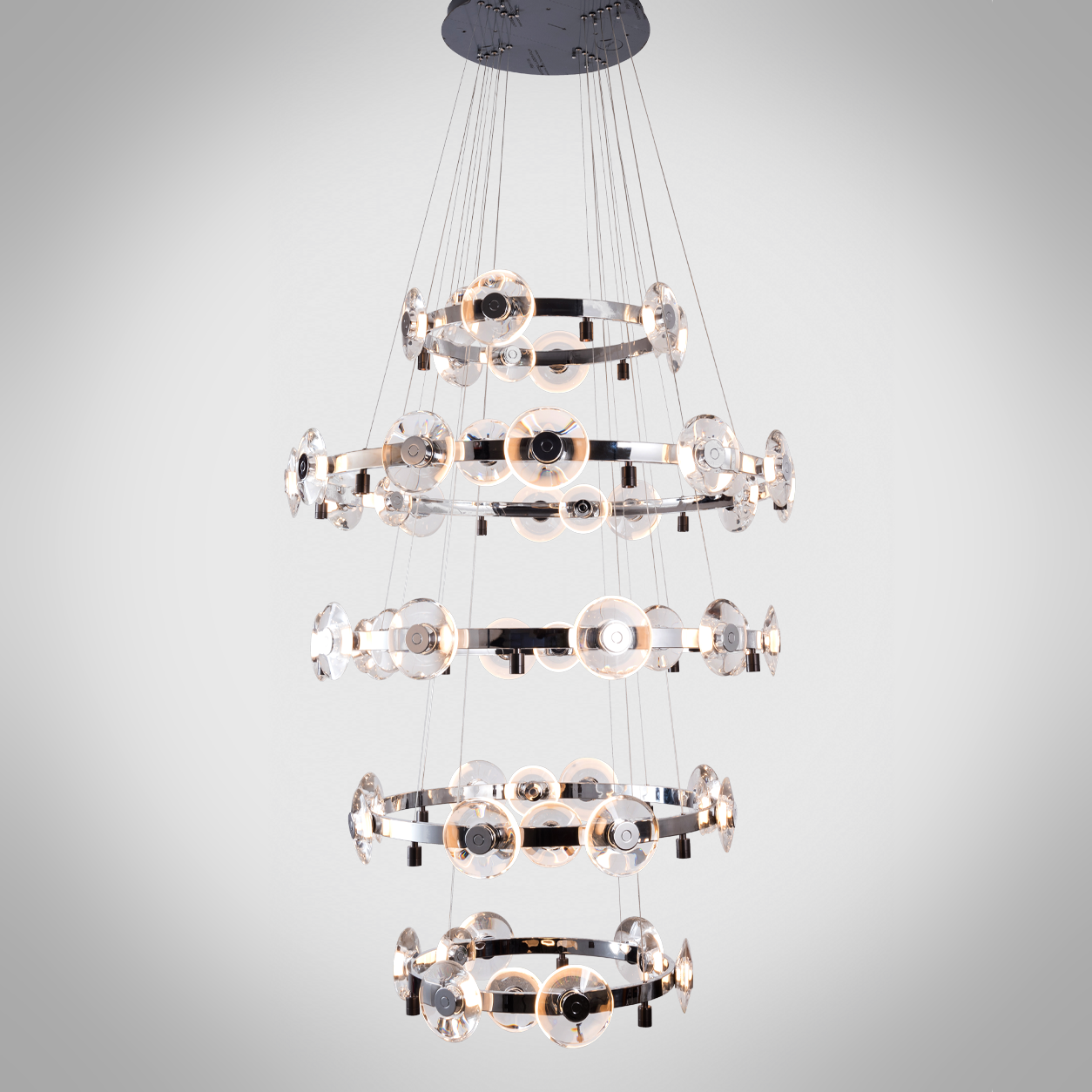 Illuminated multi-tier chrome ring crystal lens disc chandelier for high ceiling foyer and luxury staircase