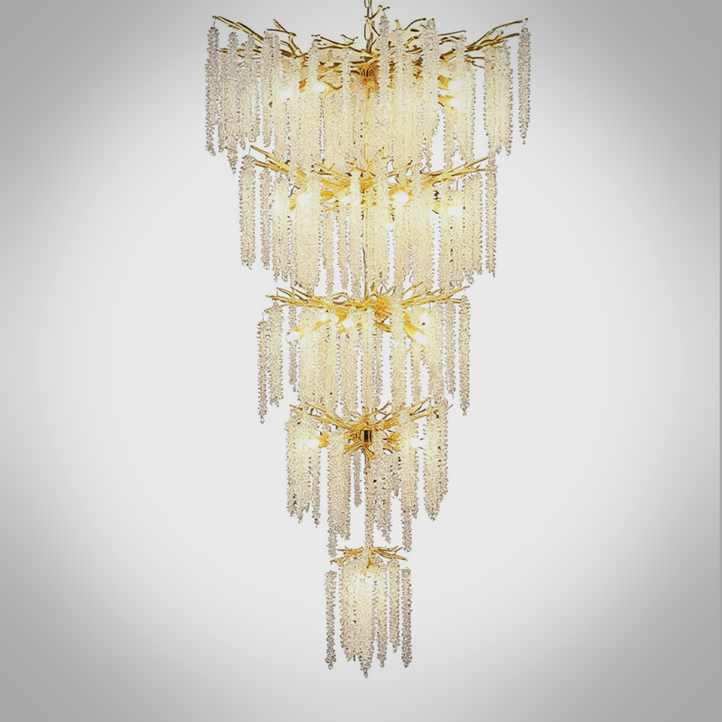 Grand cascading aluminum branch crystal chandelier installed in a double-height villa living room and foyer