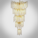 Grand cascading aluminum branch crystal chandelier installed in a double-height villa living room and foyer