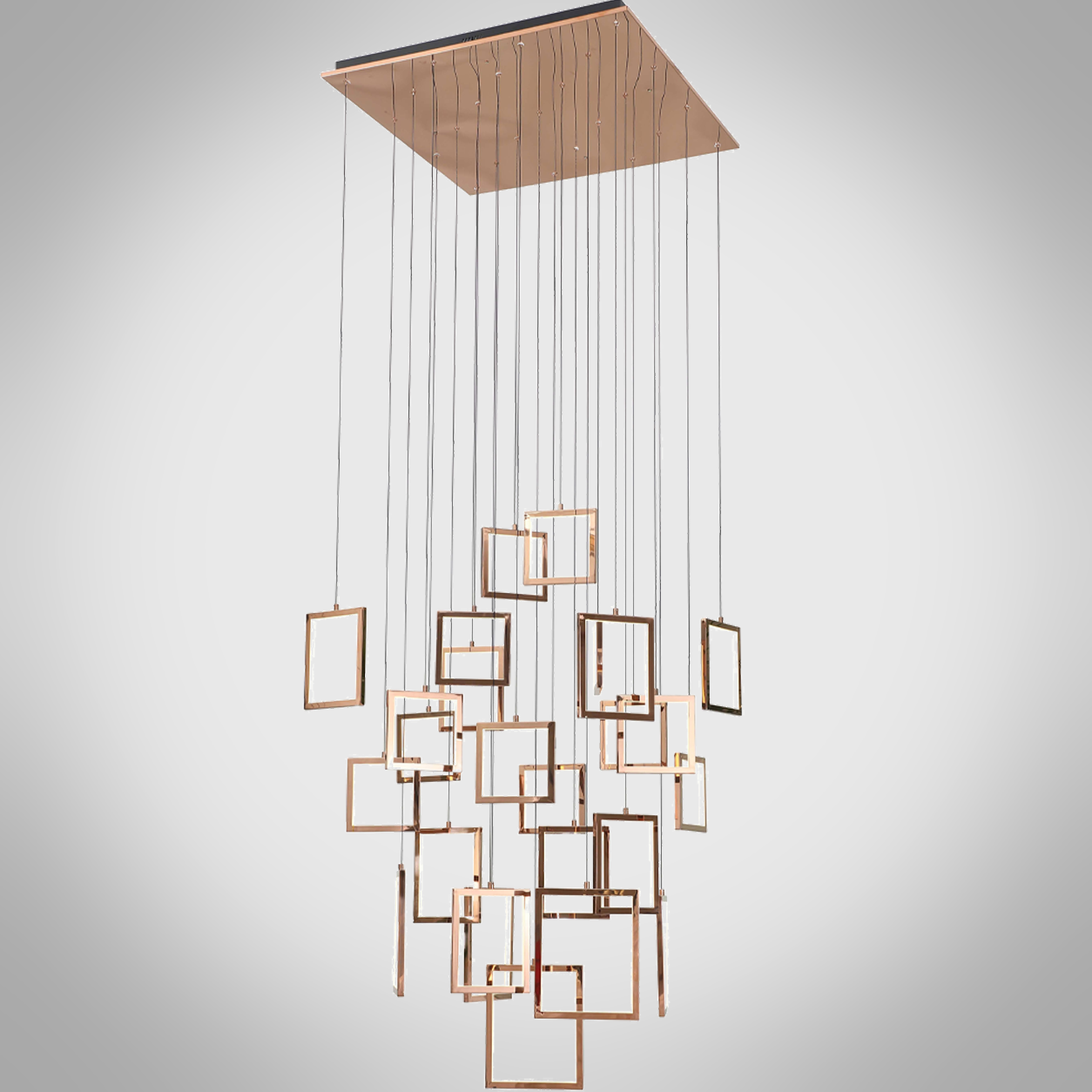 Modern rose gold stainless steel square frame cascade chandelier with mirror canopy suspended in a high ceiling foyer