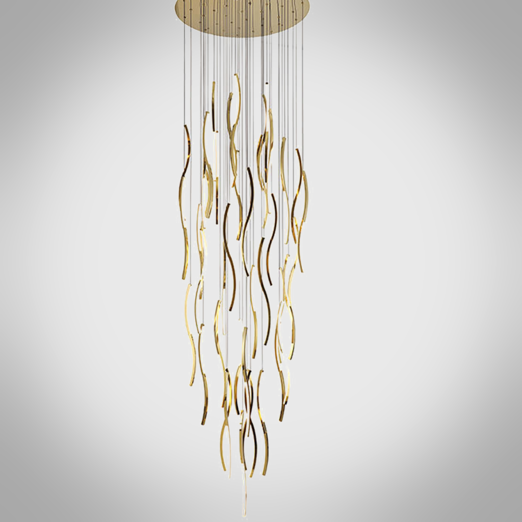 Modern gold polished stainless steel wave streamer raindrop chandelier suspended in a high ceiling villa foyer