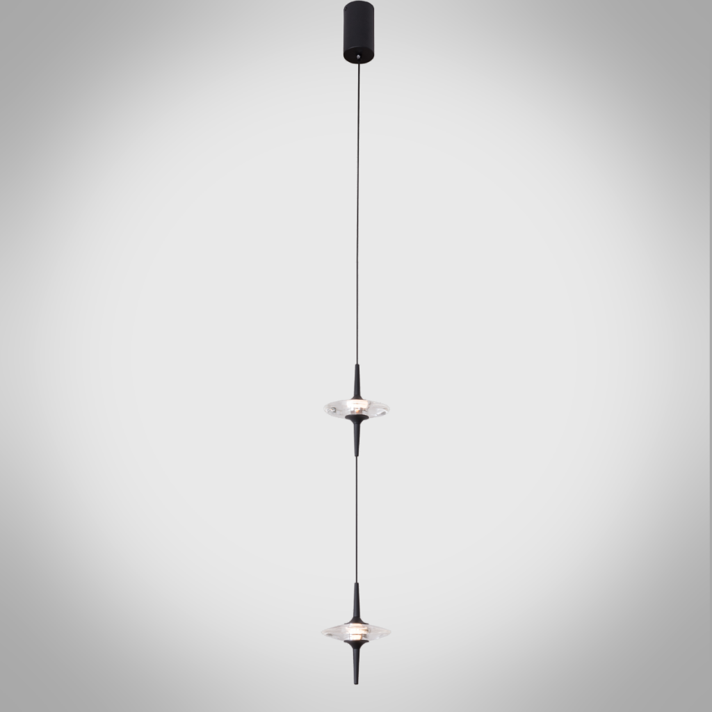 Two staggered black aluminum ufo crystal pendant lights hanging gracefully over a modern wooden dining table