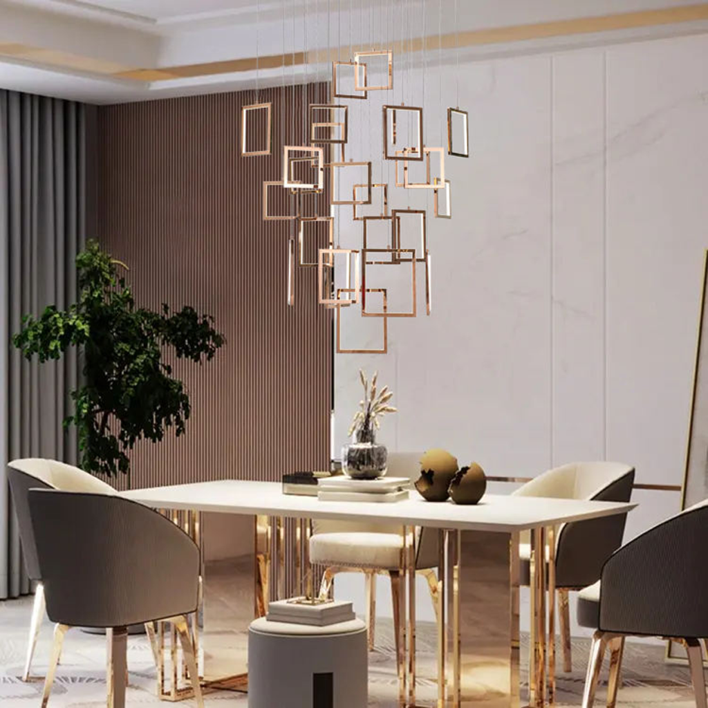 Modern rose gold stainless steel square frame cascade chandelier with mirror canopy suspended in a high ceiling foyer
