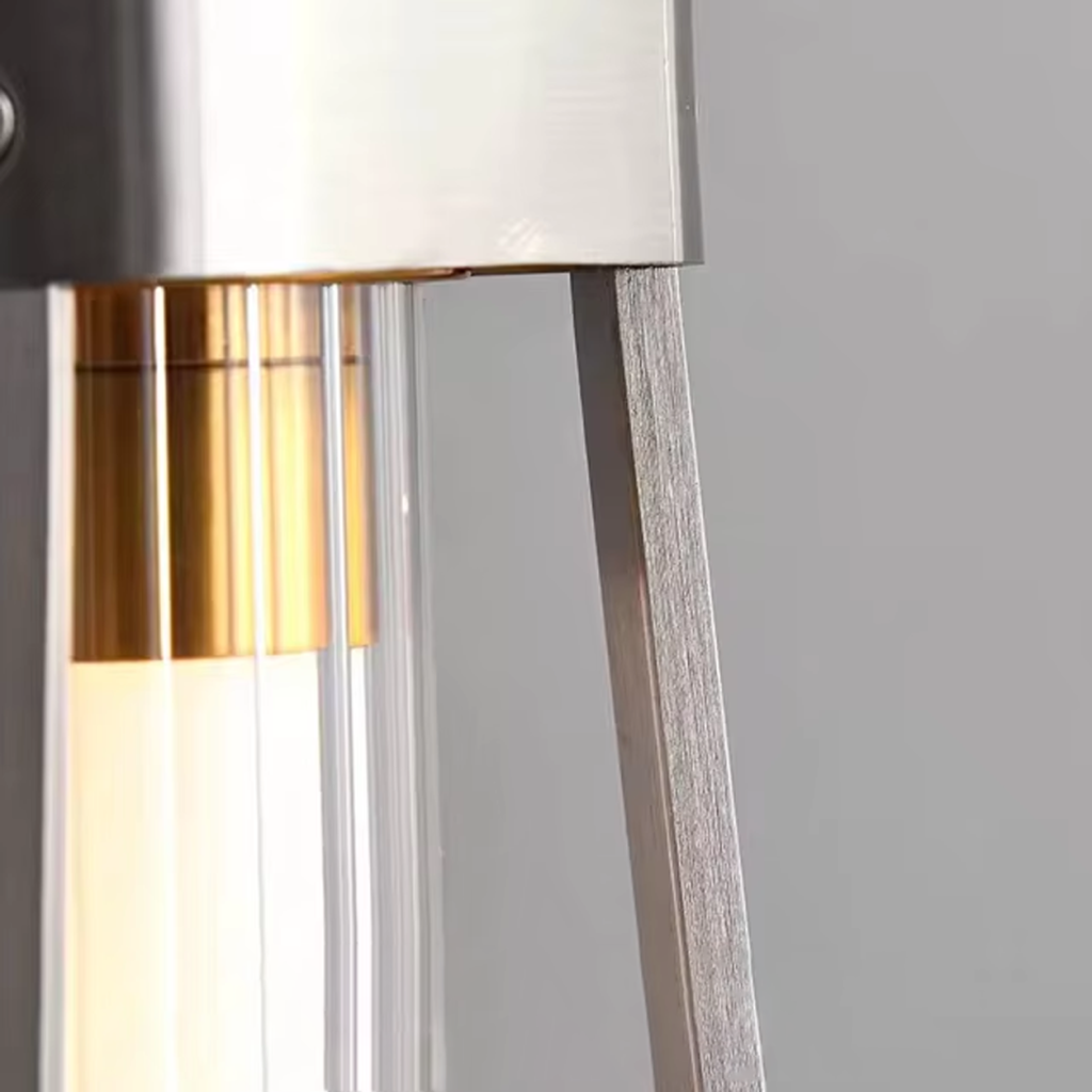 Close-up detail of brushed stainless steel bracket, fluted crystal tube, and gold aluminum inner accent on modern linear pendant light