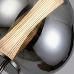 Close-up of dual-layer glass shade showing inner fluted glass diffuser tube inside smoked glass globe with iron fittings