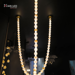 Glowing natural stone bead strand necklace chandelier with 3000K warm LED light for high ceiling living room