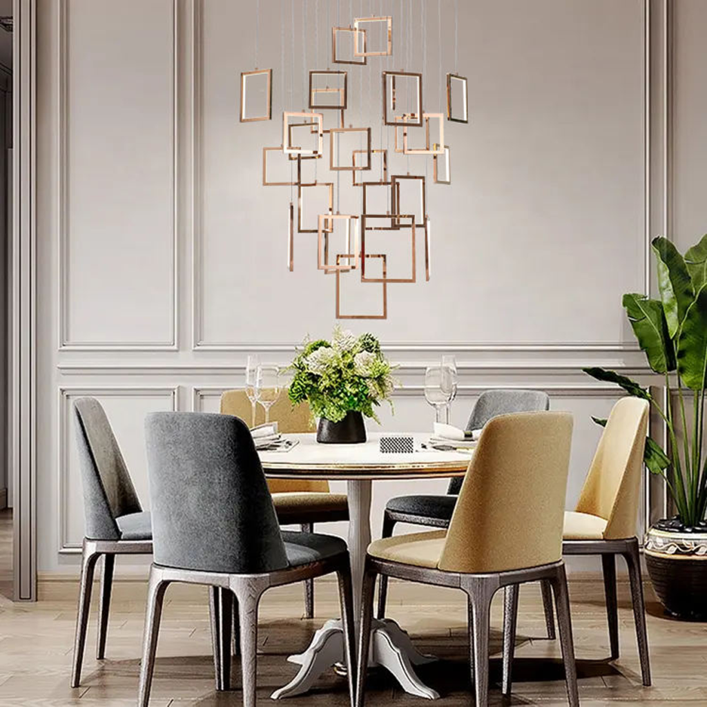 Modern rose gold stainless steel square frame cascade chandelier with mirror canopy suspended in a high ceiling foyer