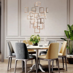 Modern rose gold stainless steel square frame cascade chandelier with mirror canopy suspended in a high ceiling foyer