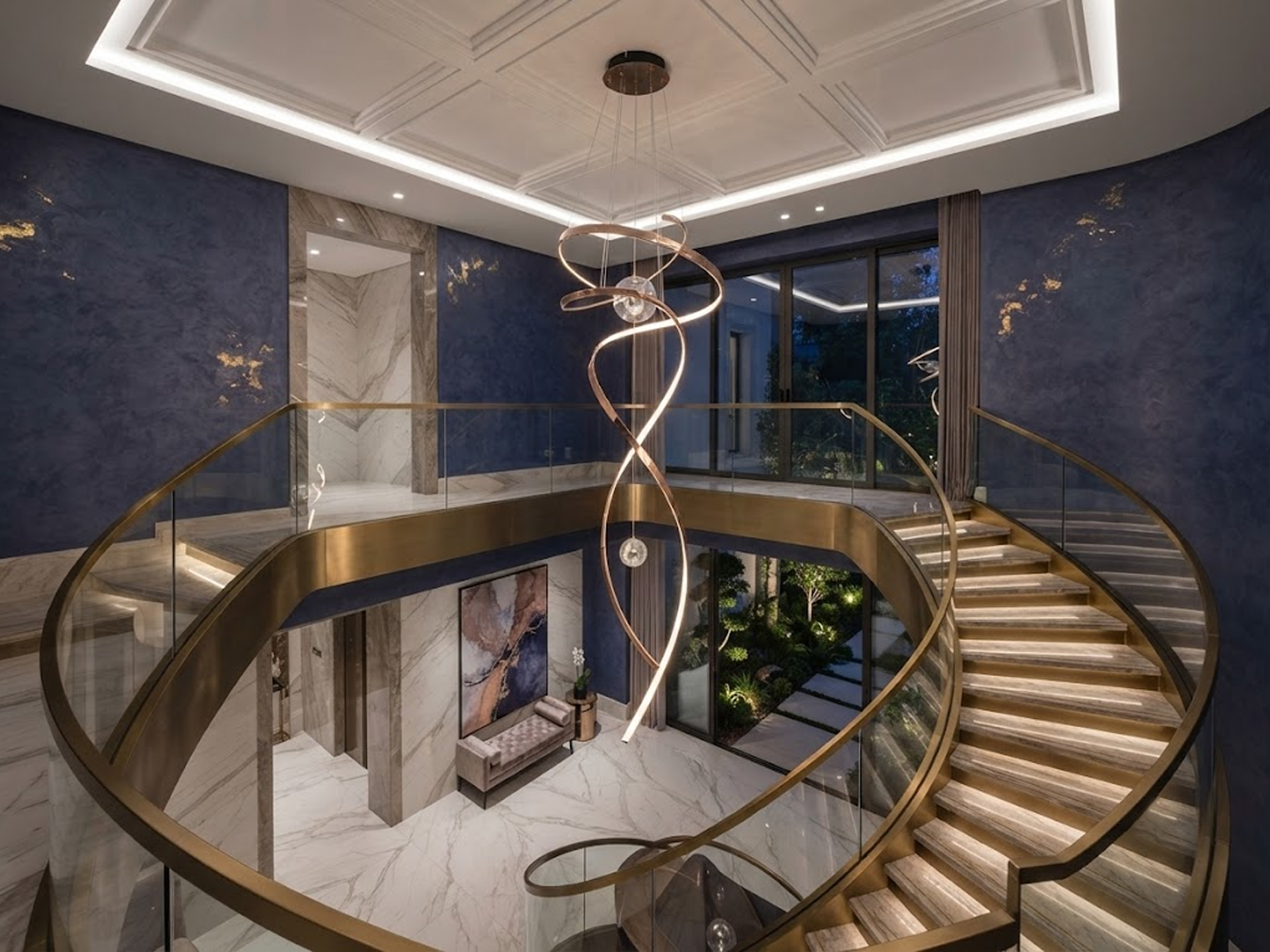 Modern rose gold stainless steel helical helix LED wave pendant light with floating orb spheres suspended in a high ceiling foyer