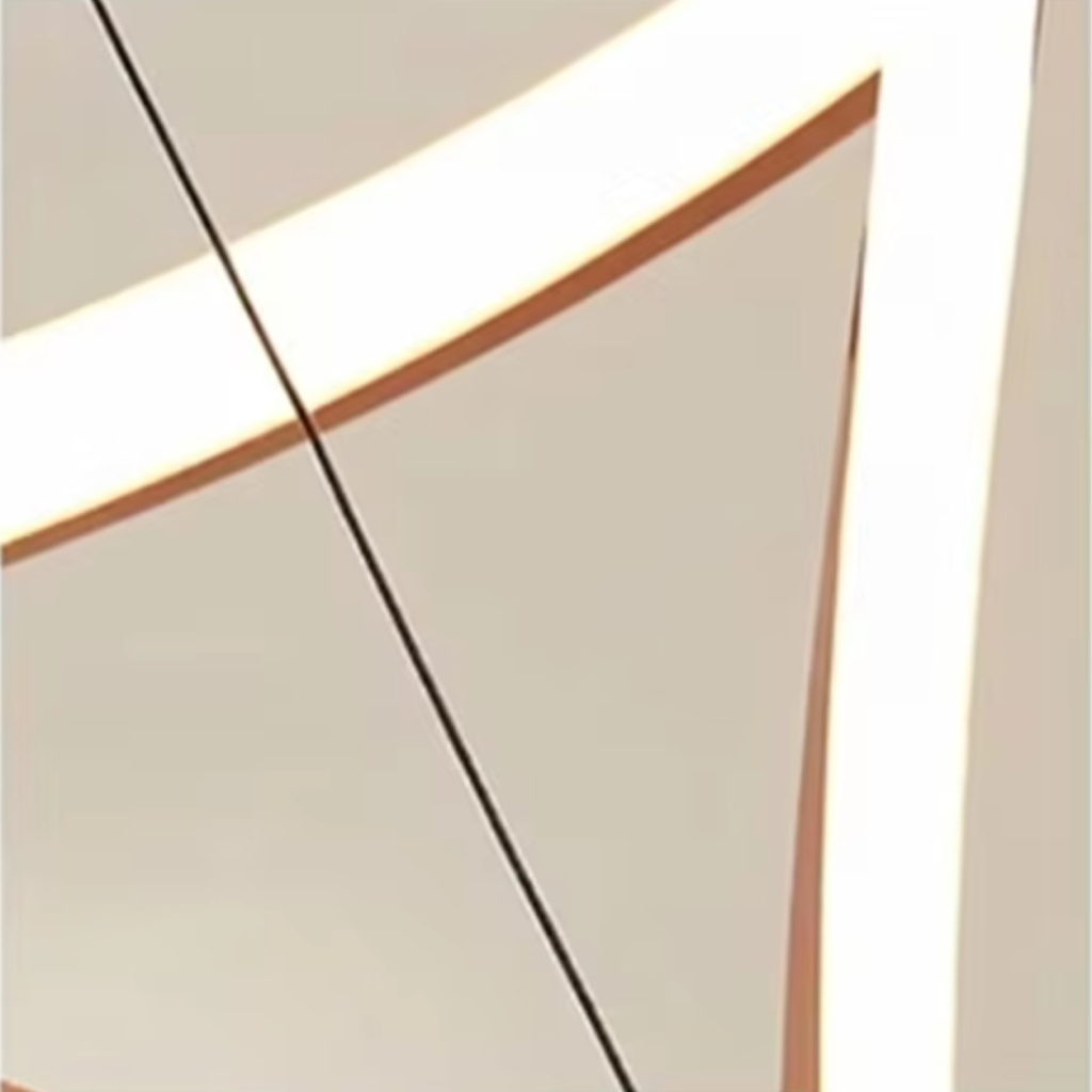 Close-up of square-tubing rose gold mirror polished stainless steel frame and integrated LED diffuser strip