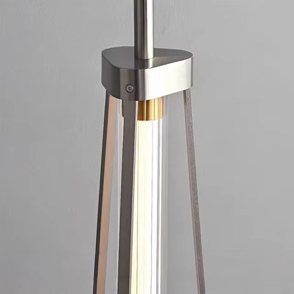 Close-up detail of brushed stainless steel bracket, fluted crystal tube, and gold aluminum inner accent on modern linear pendant light