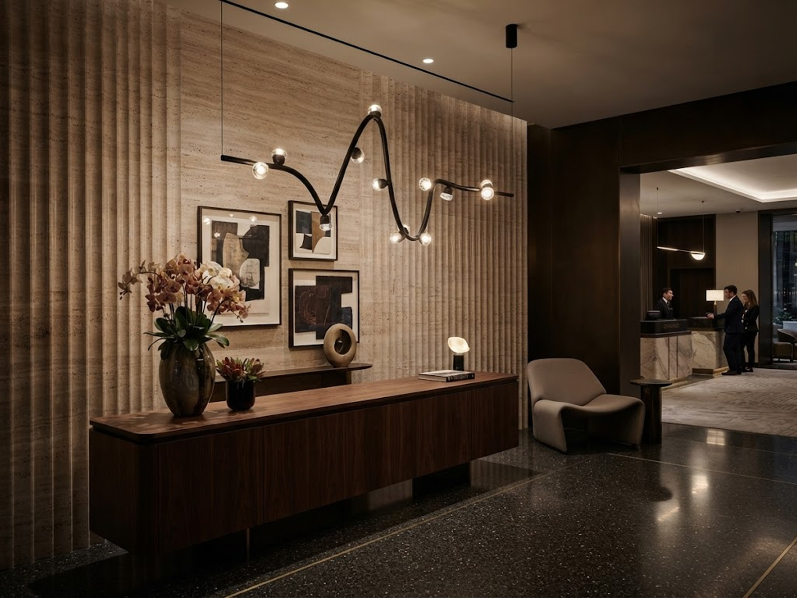 Modern soundwave wavy pendant light made of black iron, aluminum, and crystal hanging gracefully against a neutral wall