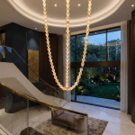 Glowing natural stone bead strand necklace chandelier with 3000K warm LED light for high ceiling living room
