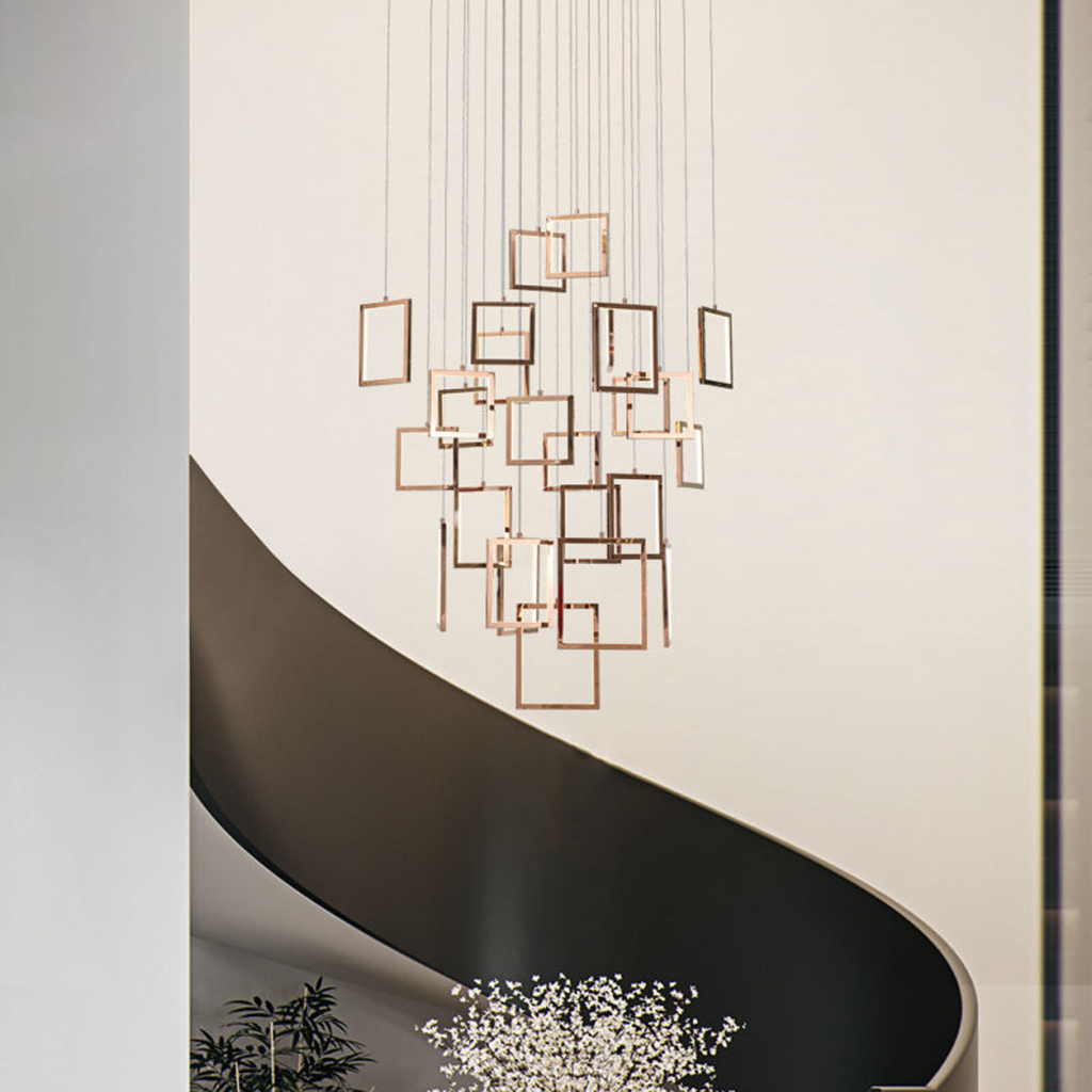 Modern rose gold stainless steel square frame cascade chandelier with mirror canopy suspended in a high ceiling foyer