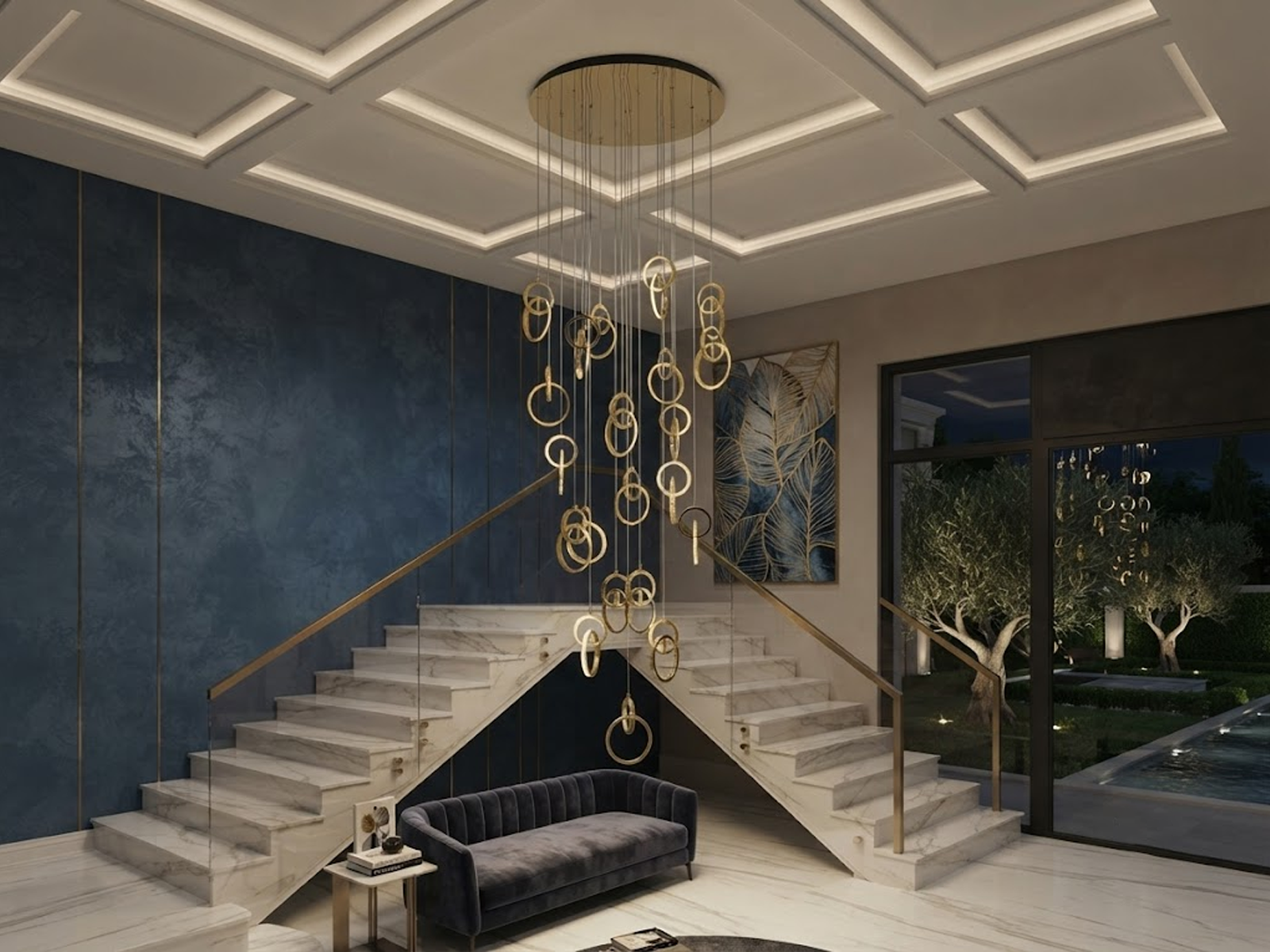 Modern gold stainless steel interlocking ring cascade chandelier suspended in a high ceiling villa foyer