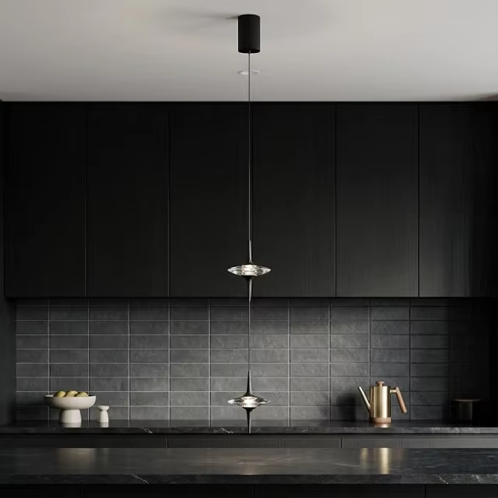 Two staggered black aluminum ufo crystal pendant lights hanging gracefully over a modern wooden dining table