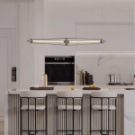 Architectural linear chandelier featuring brushed stainless steel frame, aluminum core, and fluted crystal tube hanging on stainless steel cables