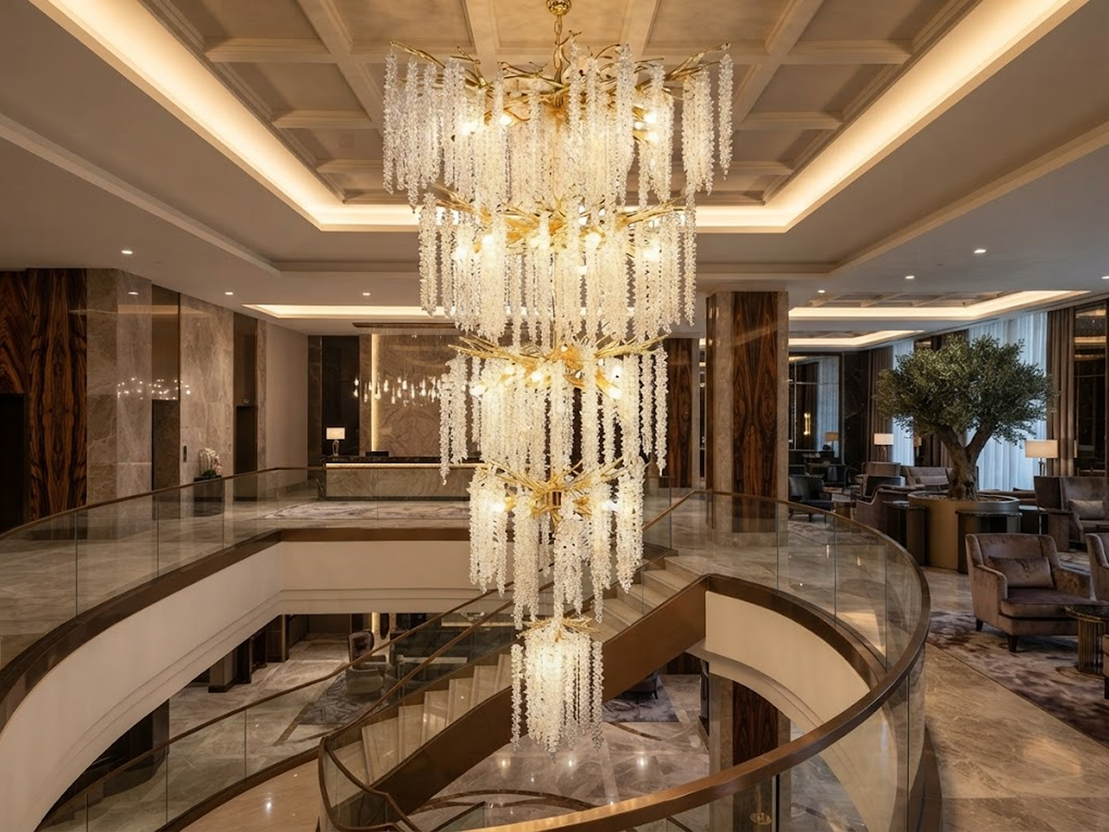 Grand cascading aluminum branch crystal chandelier installed in a double-height villa living room and foyer
