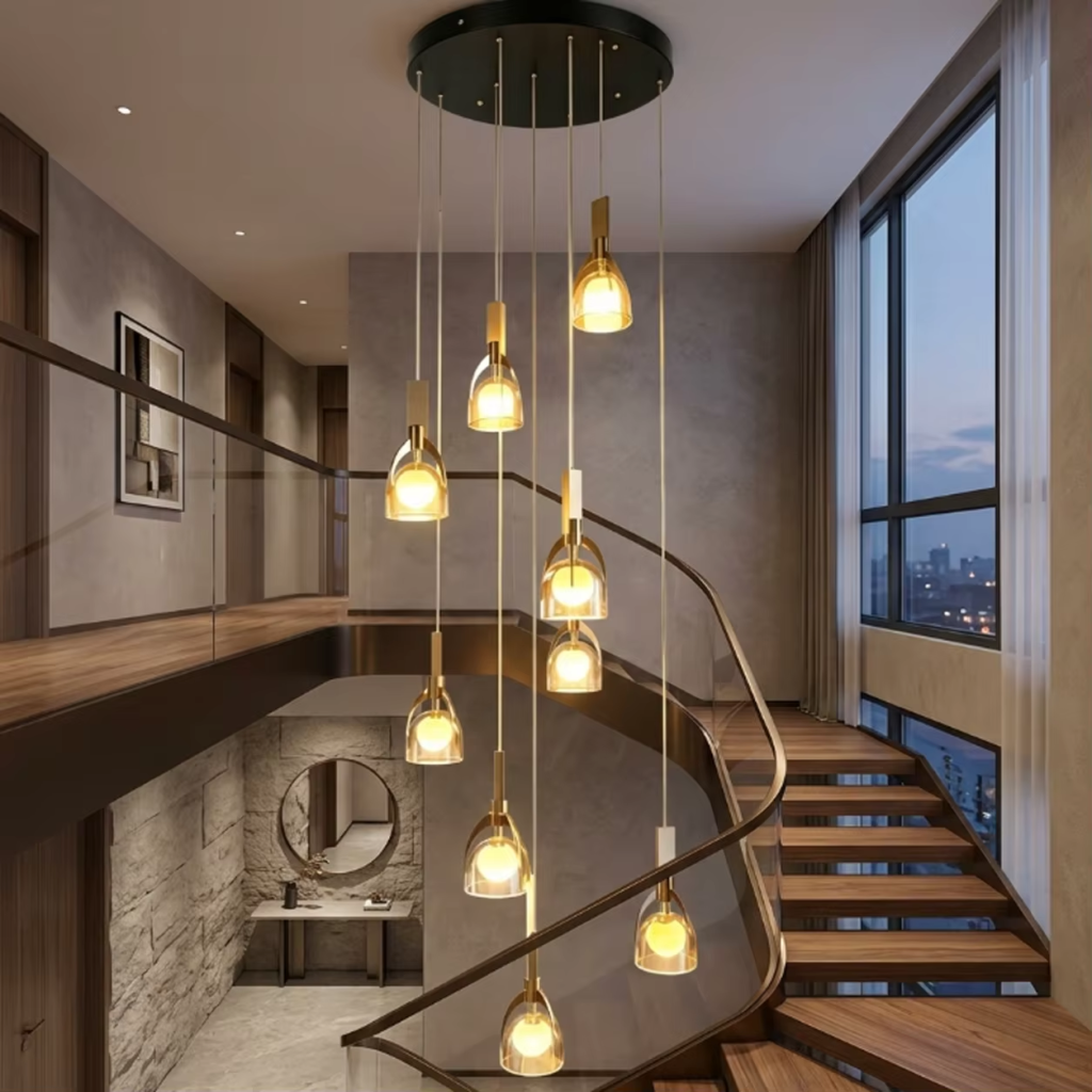 Modern spiral cascade glass and marble pendant light with brushed brown semi-matte oil stainless steel finish for high ceiling stairwells