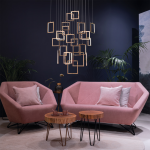 Modern rose gold stainless steel square frame cascade chandelier with mirror canopy suspended in a high ceiling foyer