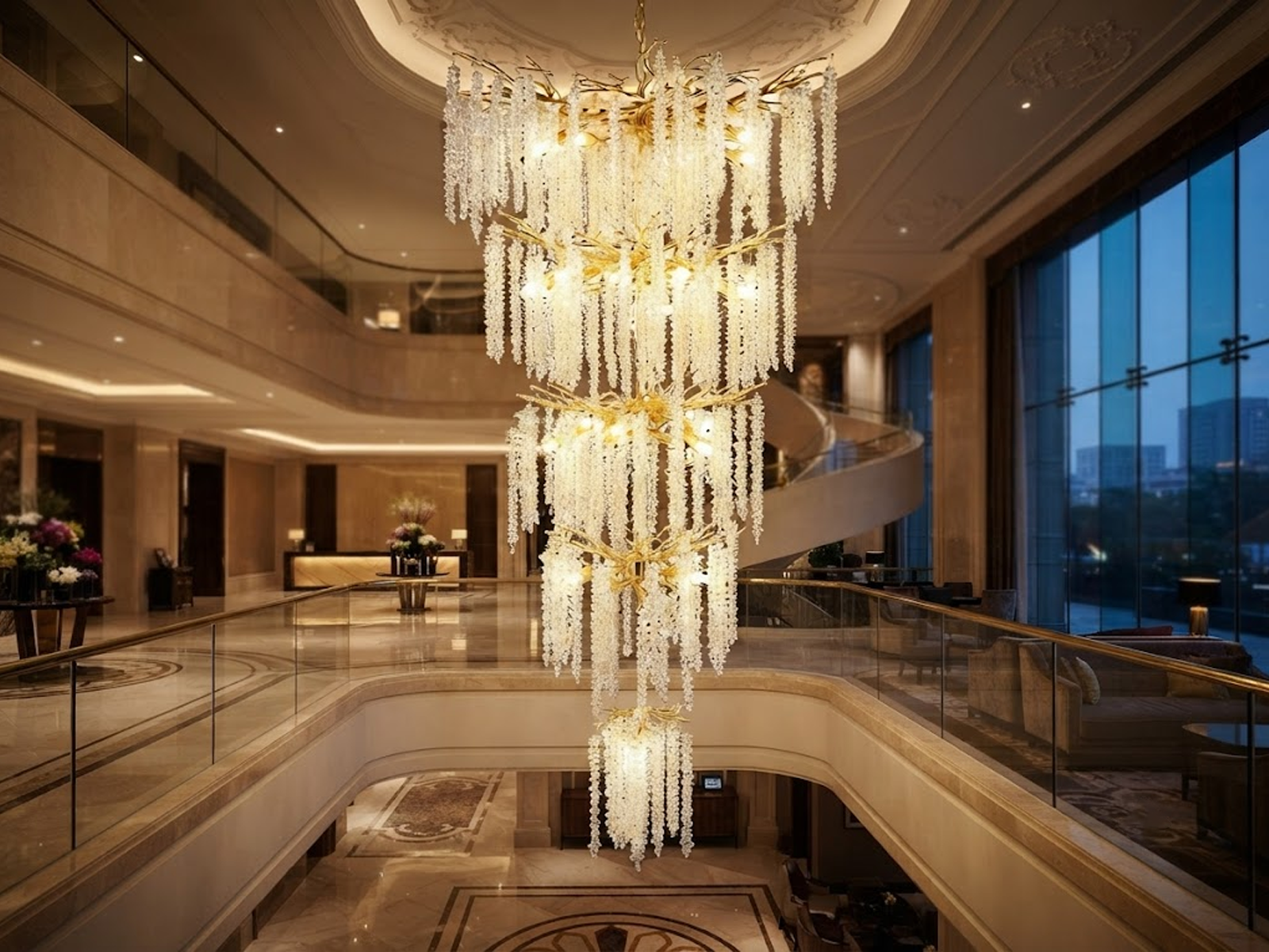 Grand cascading aluminum branch crystal chandelier installed in a double-height villa living room and foyer