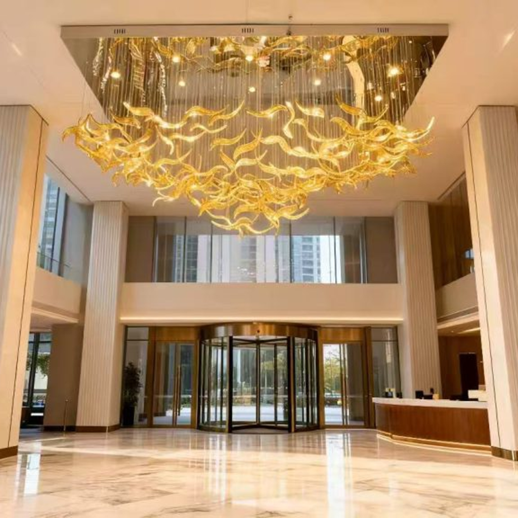 Illuminated 2400mm floating wave glass chandelier casting warm 3000K ambient glow for luxury hotel lobby