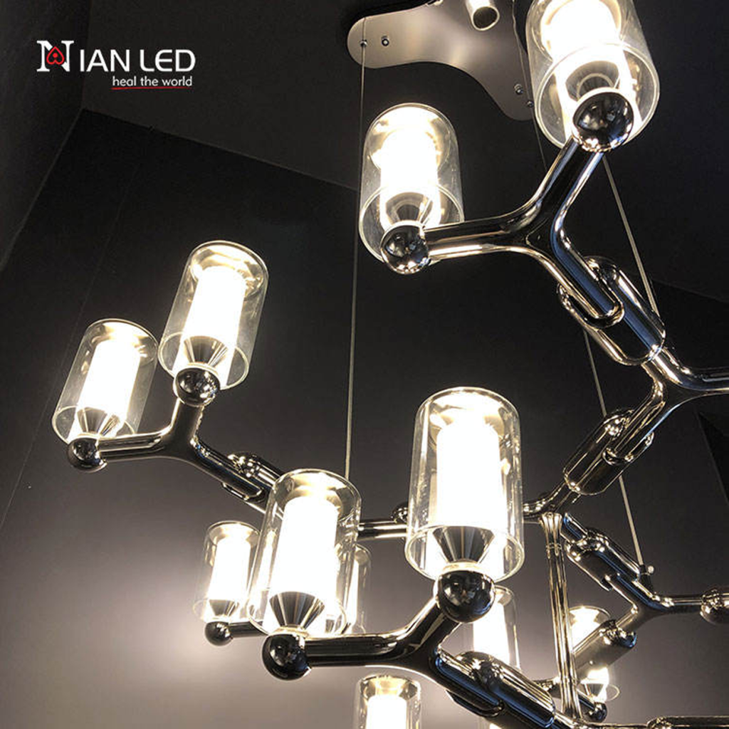 Modern multi-tiered chrome modular branching ring chandelier with tri-spoke canopy base for high ceiling living room and villa foyer