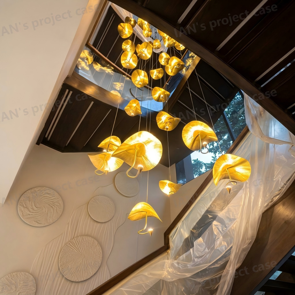 Modern luxury hand-hammered gold ginkgo leaf multi-light cascading chandelier for high ceiling staircase and duplex foyer
