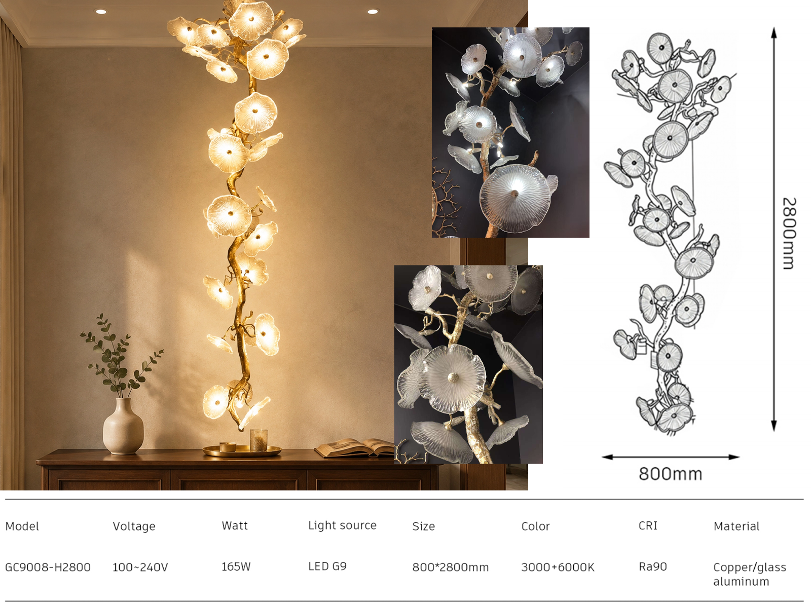 Handcrafted organic glass leaf tree branch vertical chandelier hanging in a luxury high-ceiling staircase foyer