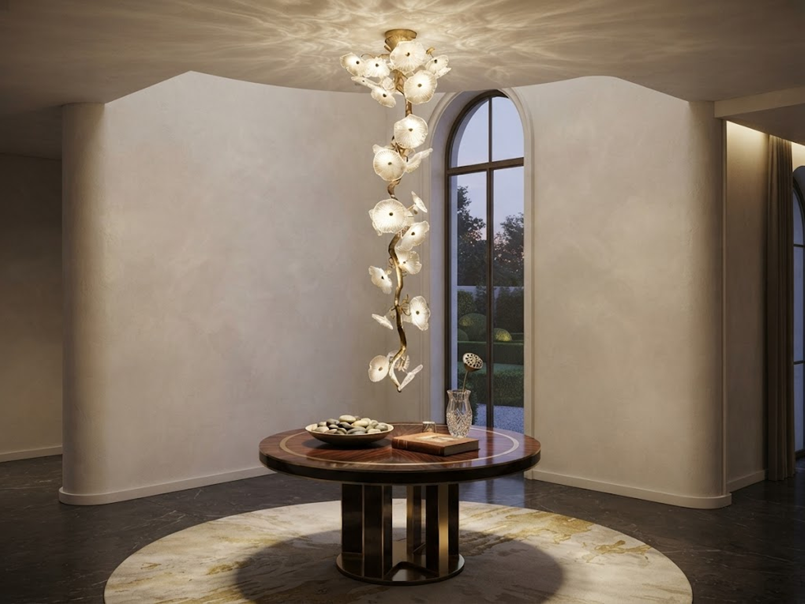 Handcrafted organic glass leaf tree branch vertical chandelier hanging in a luxury high-ceiling staircase foyer