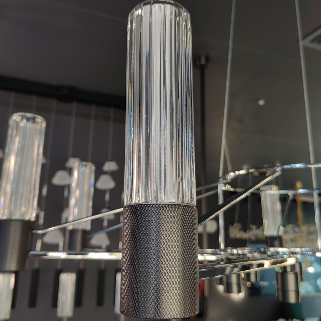 Macro view of ribbed clear glass column showcasing light refraction