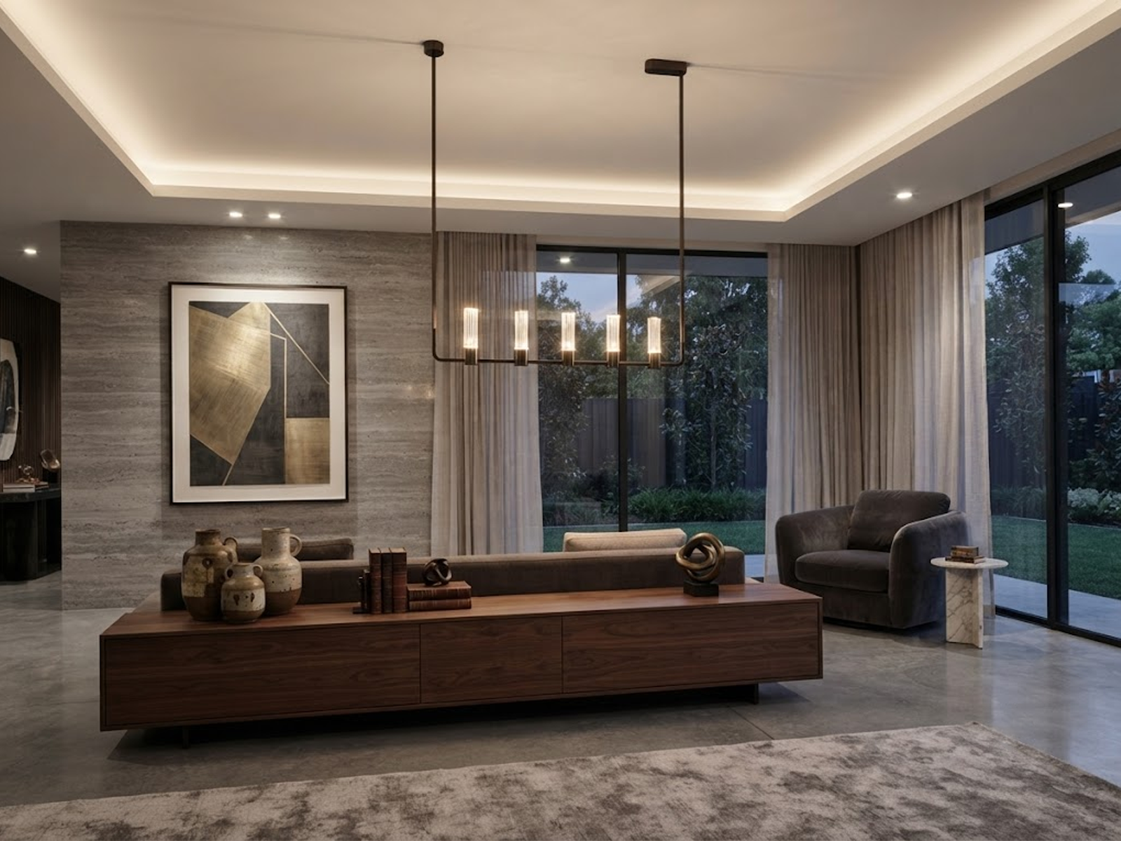 The Atelier matte black rectangular linear chandelier hanging over a wooden dining table in a luxury apartment