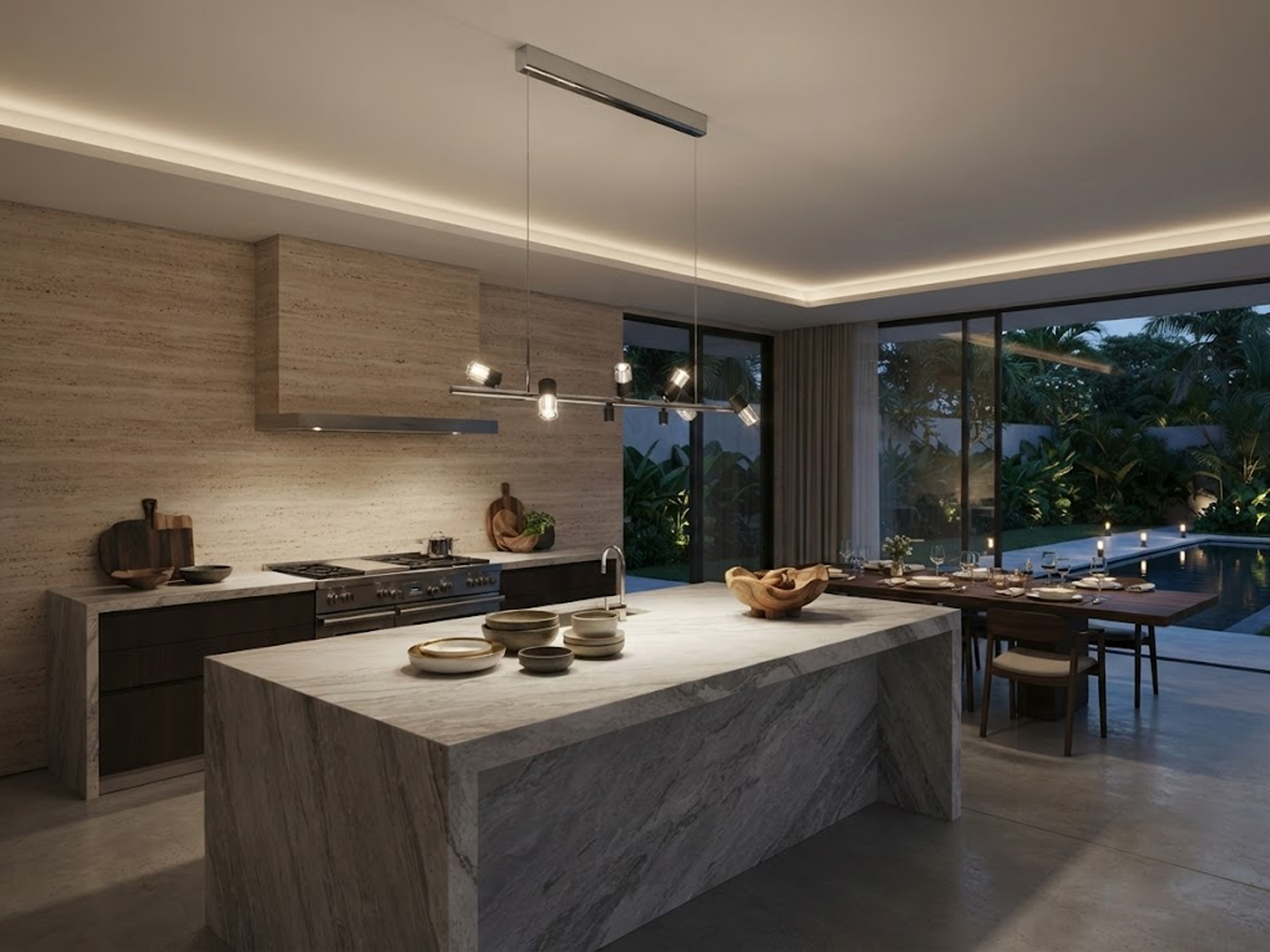 The Metro linear adjustable spotlight chandelier suspended over a modern marble kitchen island