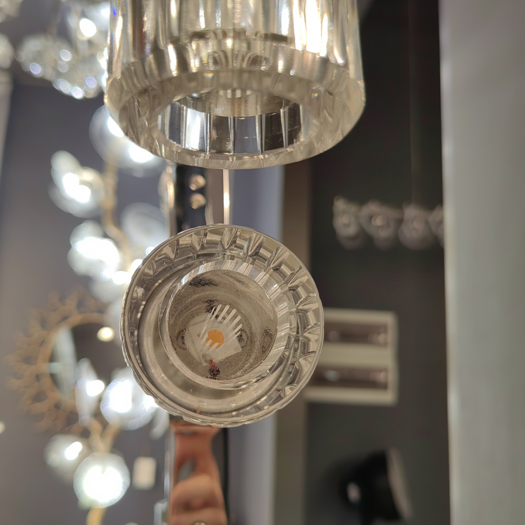Bottom view close up of integrated COB LED chip inside fluted crystal glass shade