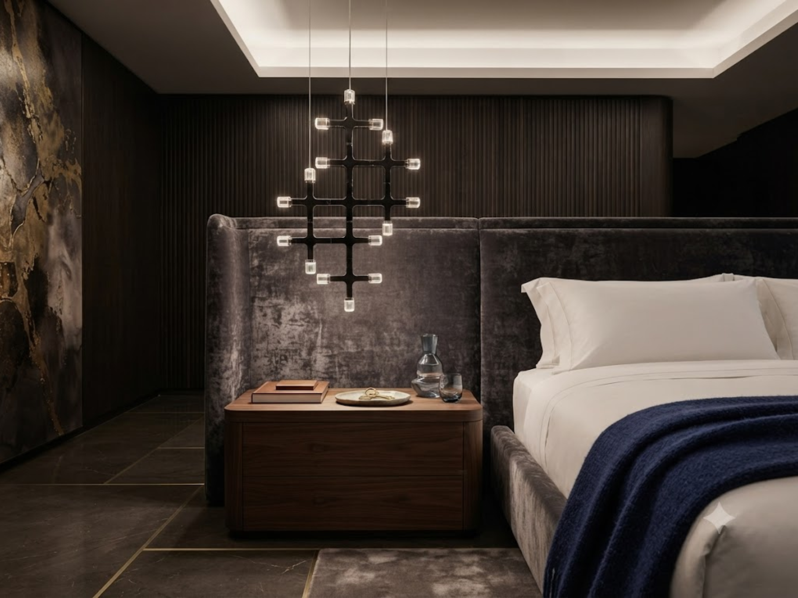 The Lattice modular chrome grid chandelier with multi directional crystal light heads hanging against wall