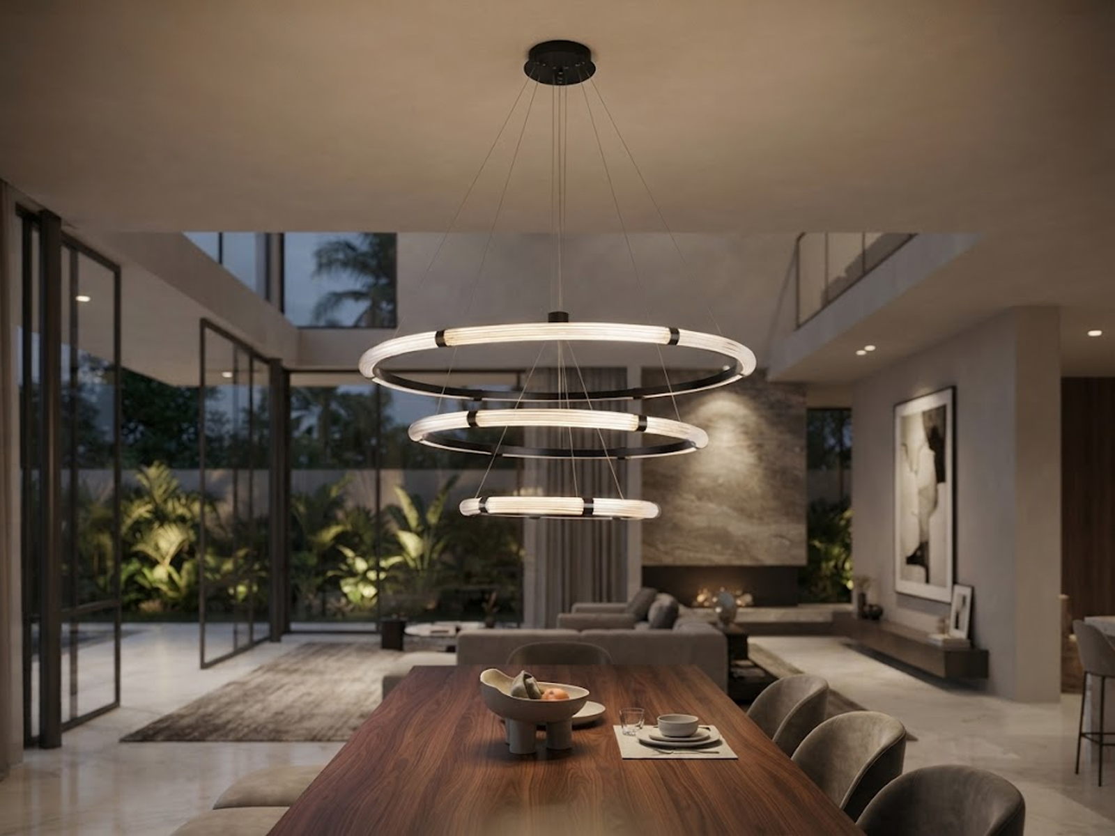 The Aura 3 tier fluted acrylic LED ring chandelier hanging in a modern double height ceiling living room