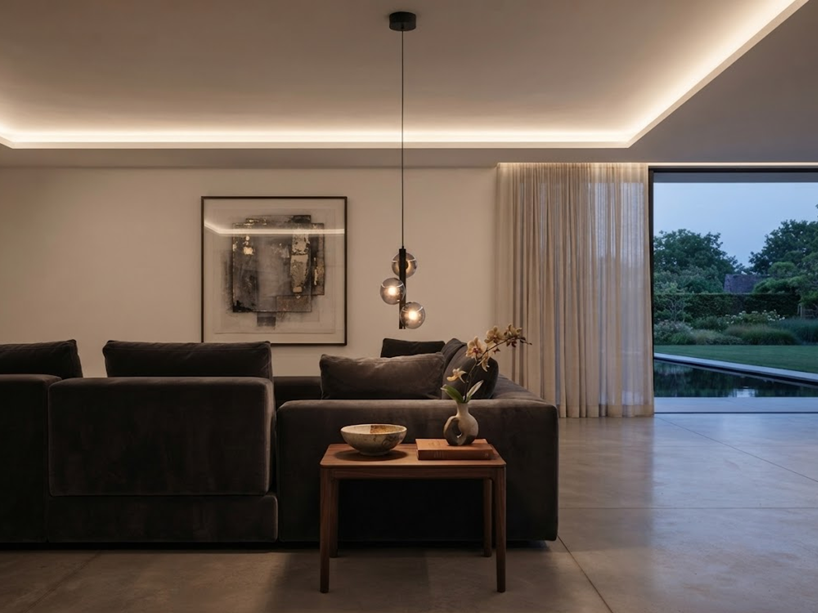 The Stellar mini pendant chandelier featuring three smoky glass orb shades on vertical black column