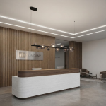 The Constellation smoky glass sphere linear chandelier hanging over a modern marble reception desk