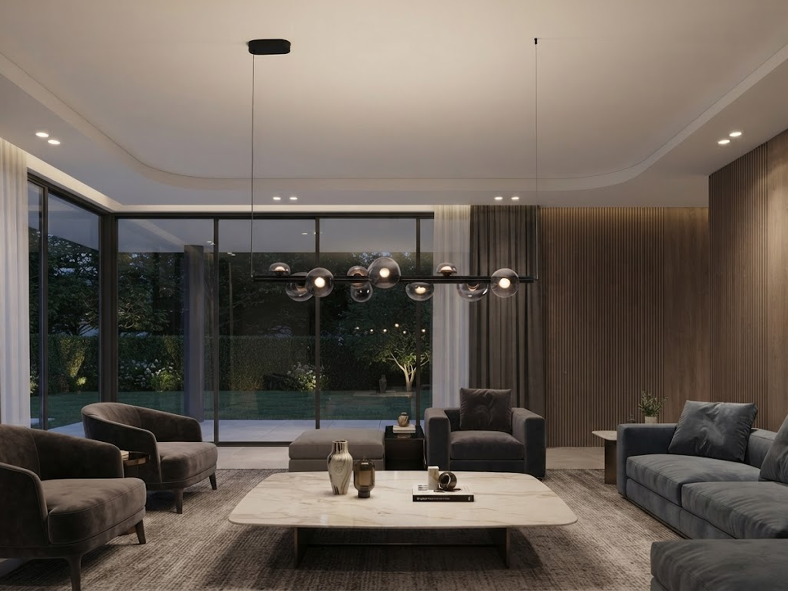 The Constellation smoky glass sphere linear chandelier hanging over a modern marble reception desk