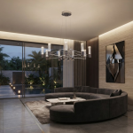 The Crown multi light fluted glass ring chandelier suspended over a modern sectional sofa in a high ceiling living room