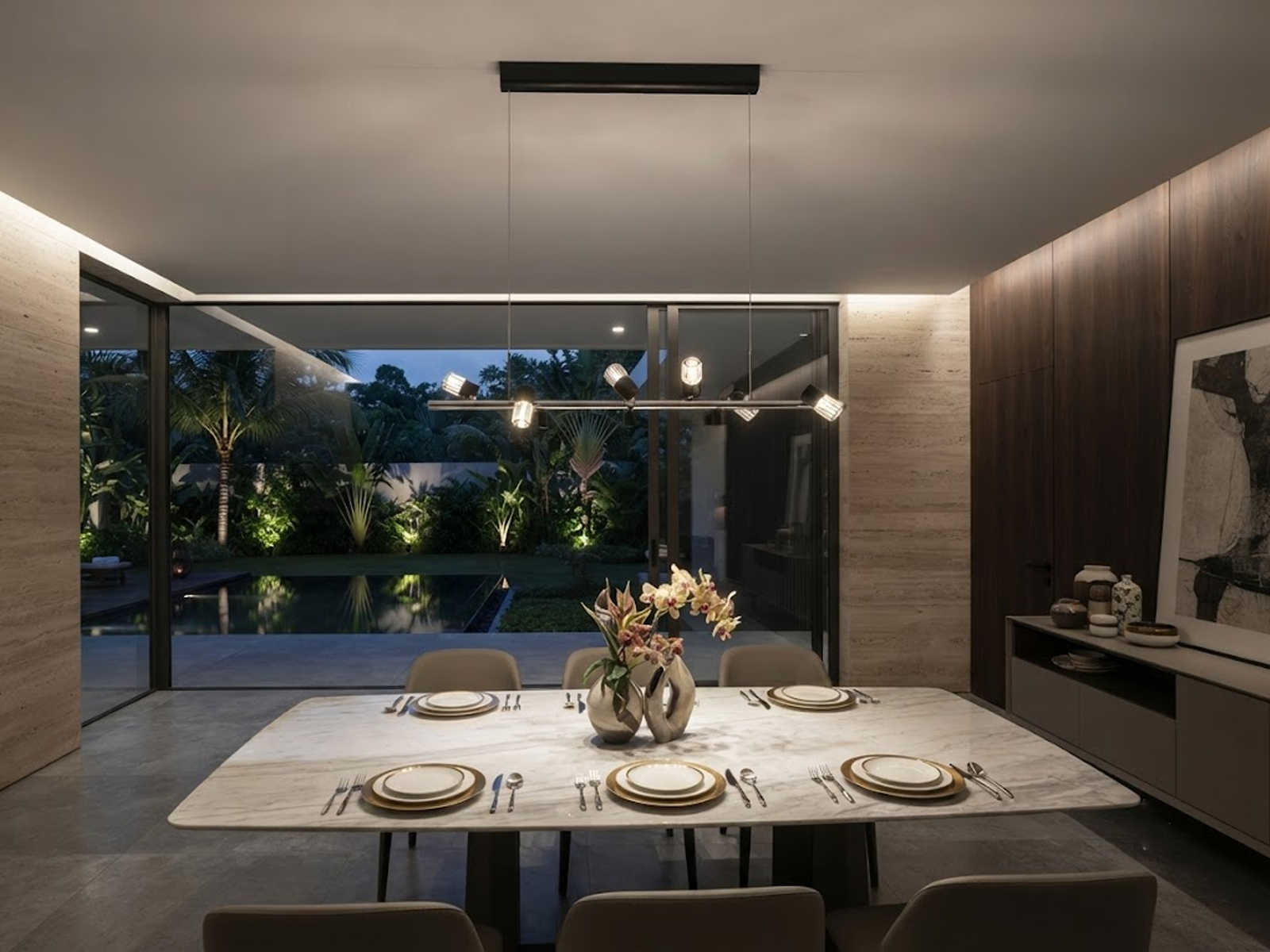 The Metro linear adjustable spotlight chandelier suspended over a modern marble kitchen island
