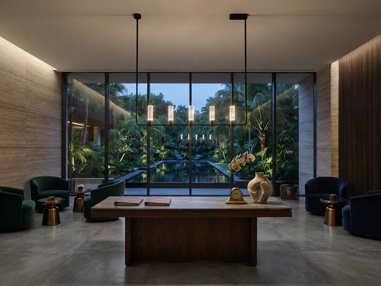The Atelier matte black rectangular linear chandelier hanging over a wooden dining table in a luxury apartment