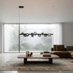 The Constellation smoky glass sphere linear chandelier hanging over a modern marble reception desk
