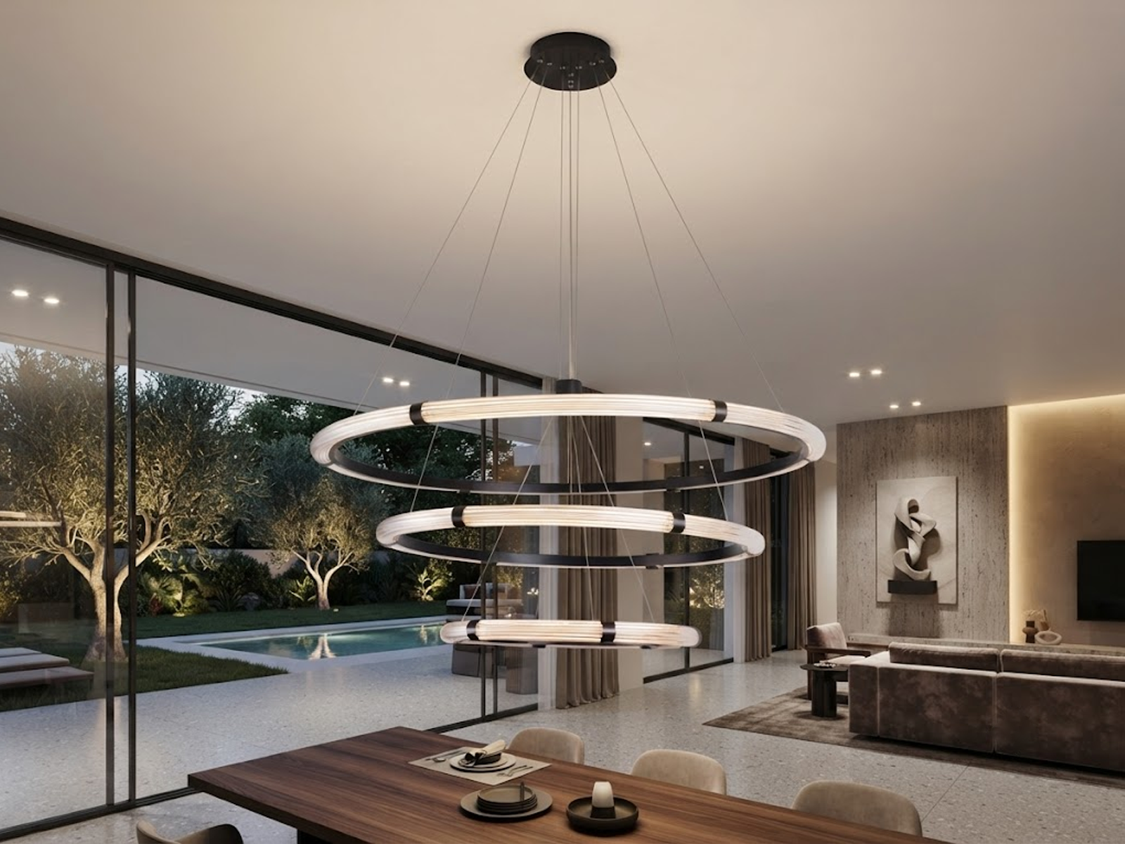 The Aura 3 tier fluted acrylic LED ring chandelier hanging in a modern double height ceiling living room