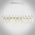 Large crystal-texture feather linear LED chandelier hanging above a luxury marble hotel reception desk in a contemporary lobby