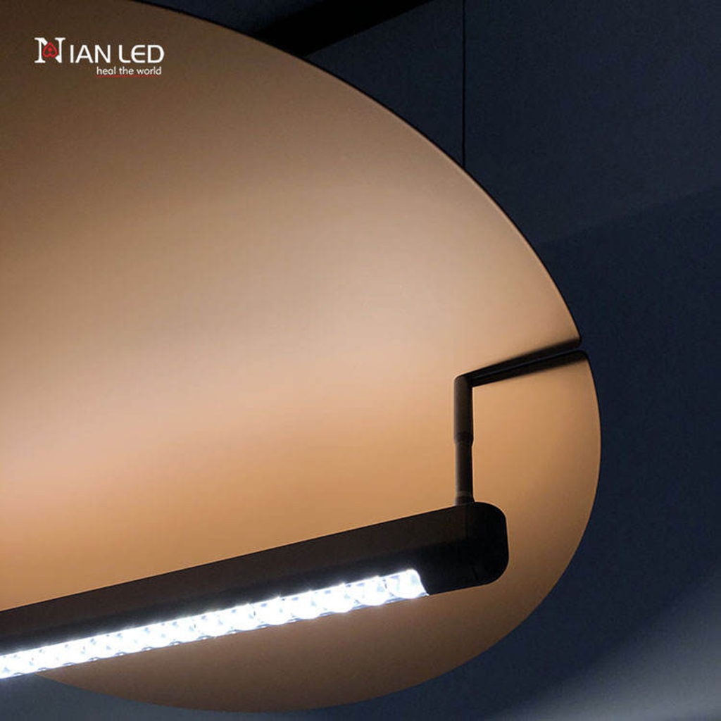 Detailed close-up of matte black aluminum LED housing with optical micro-lenses under bronze aluminum reflector disc