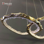 Close-up of interlocking gold zinc alloy rings with glowing crushed ice optical acrylic diffusers